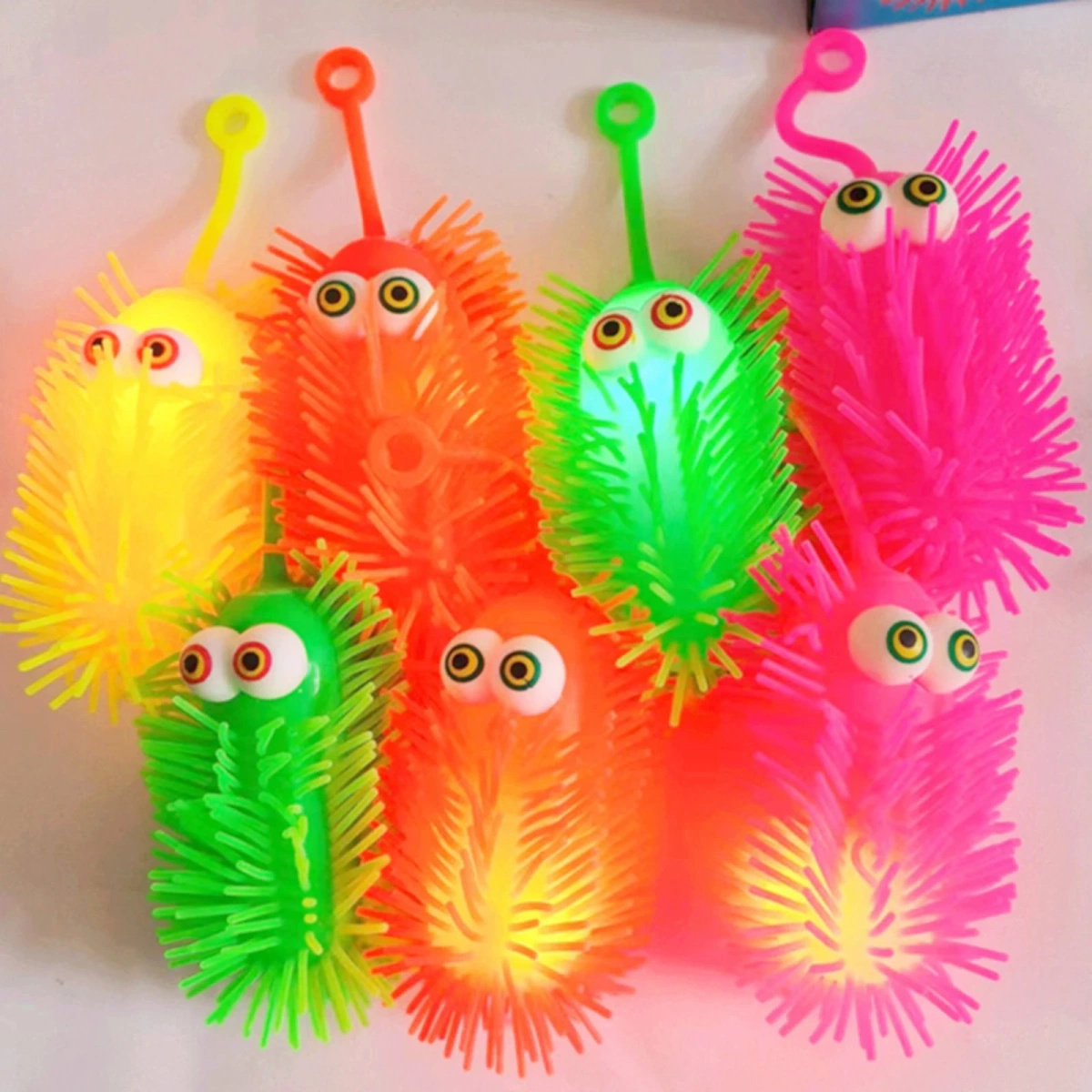 ZABAWKA ANTYSTRESOWA SILIKONOWY GNIOTEK GĄSIENICA ŚWIECĄCY LED SENSORYCZNY